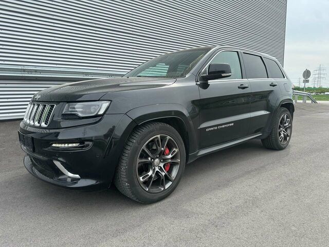 Чорний Джип Grand Cherokee, об'ємом двигуна 6.42 л та пробігом 165 тис. км за 39903 $, фото 1 на Automoto.ua