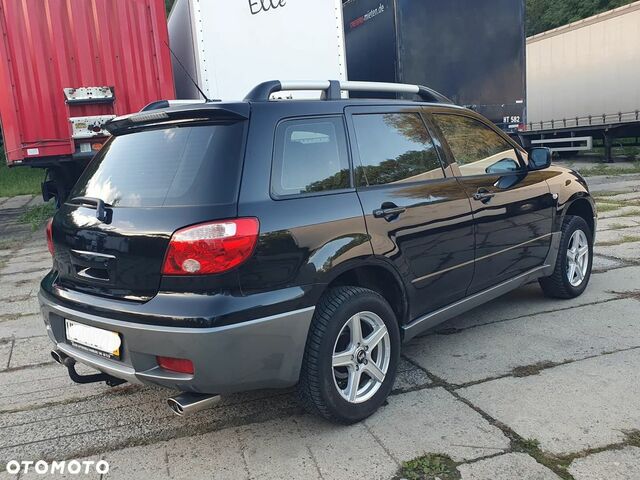 Мицубиси Аутлендер 2005 в Европе на Automoto.ua Черный Мицубиси Аутлендер, объемом двигателя 1 л и пробегом 227 тыс. км за 15900 $, фото 5 на Automoto.ua