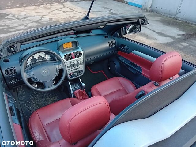 Опель Тигра 2008 в Европе на Automoto.ua Черный Опель Тигра, объемом двигателя 1 л и пробегом 226 тыс. км за 17500 $, фото 15 на Automoto.ua