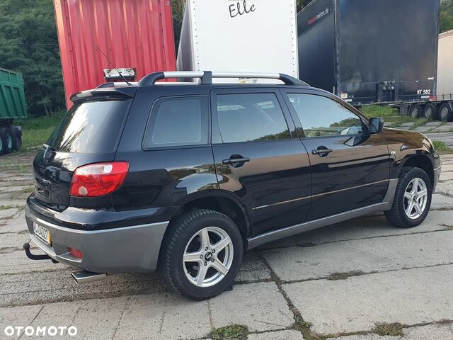 Мицубиси Аутлендер 2005 в Европе на Automoto.ua Черный Мицубиси Аутлендер, объемом двигателя 1 л и пробегом 227 тыс. км за 15900 $, фото 2 на Automoto.ua